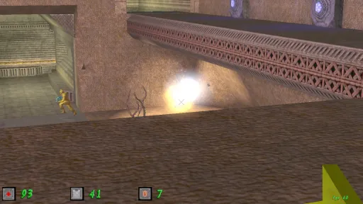 Green Nation gameplay showing an explosion or energy impact beneath an elevated metal bridge outside a rocky industrial base, with a yellow plastic army man nearby.