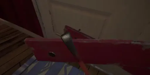 Hello Neighbor VR: Search and Rescue close-up showing a crowbar being used to pry boards from a blocked door or window.