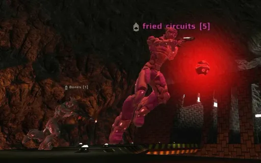 Iron Fist gameplay on Coila, showing a player running with the Bomb in Bomb Run mode inside the lava cavern arena.