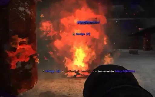 Iron Fist gameplay on Ware-Bomb, showing the moment after a Rocket Launcher explosion erupts in a warehouse combat area.